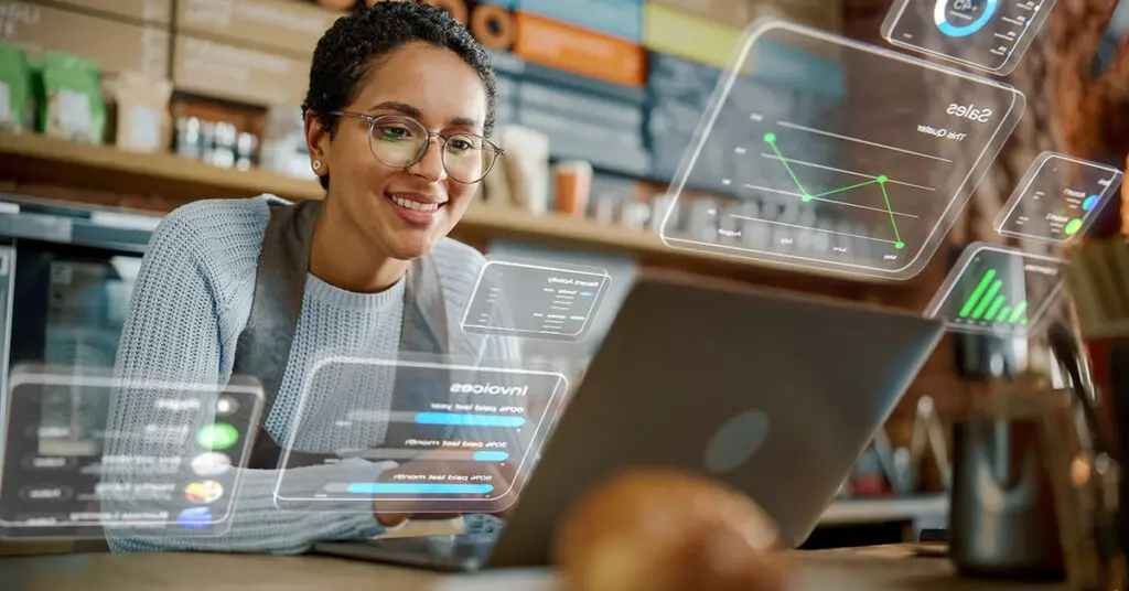 Business owner reviewing website platform options on a laptop, comparing performance, flexibility, and SEO features