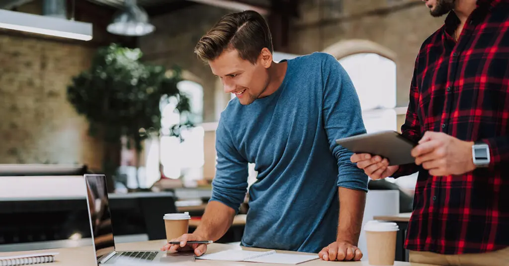 Small business owner planning a digital marketing strategy at their desk during a quiet work period
