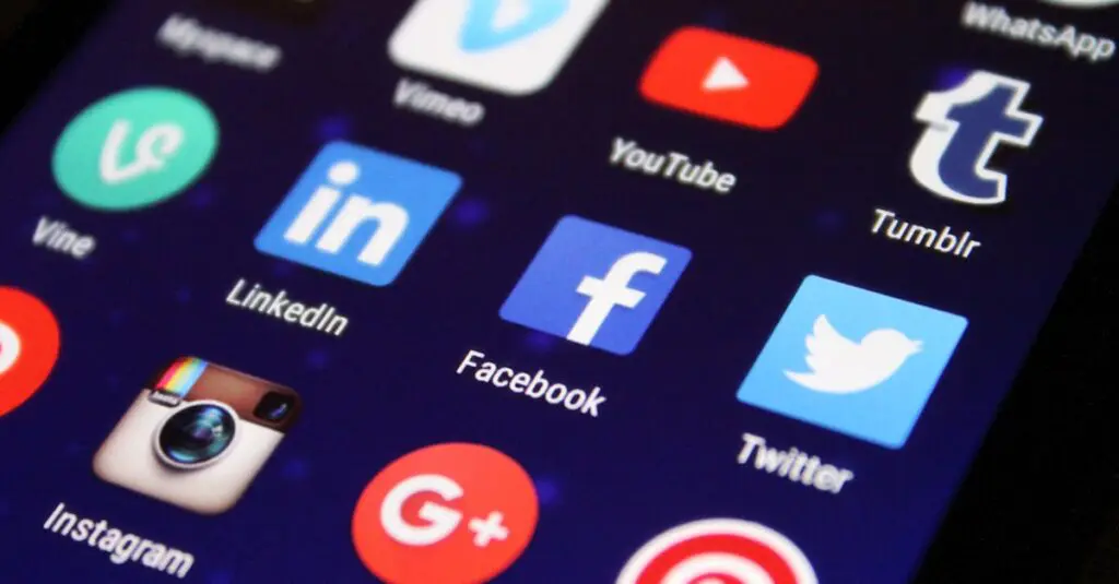 social media app icons on a mobile phone screen
