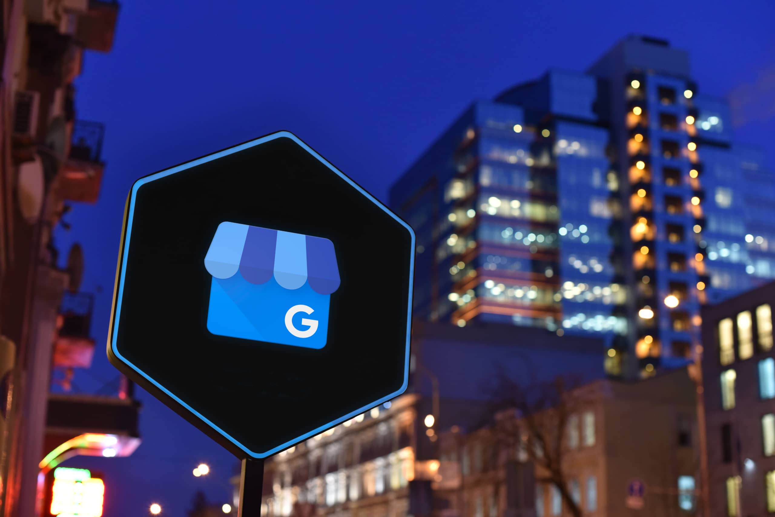 An image of Google's Business Profile icon against a city skyline