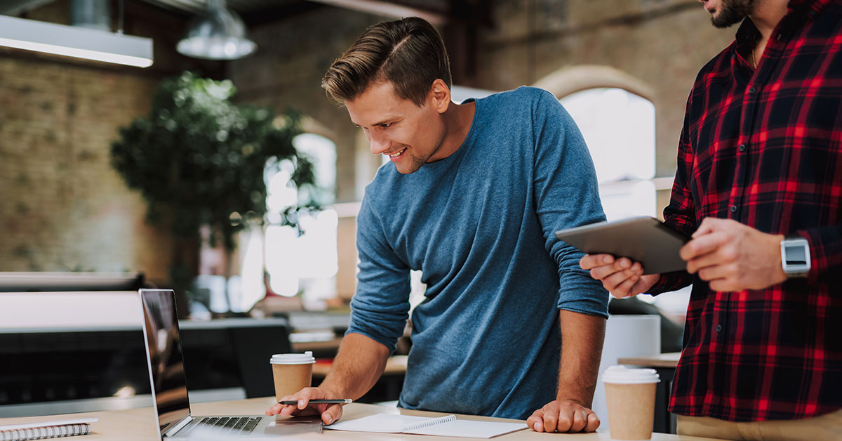 Small business owner planning a digital marketing strategy at their desk during a quiet work period